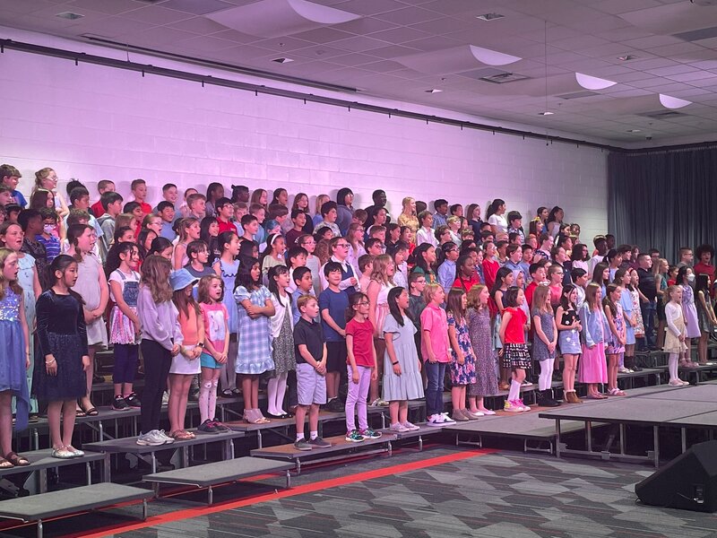 Fourth grade students performing a musical